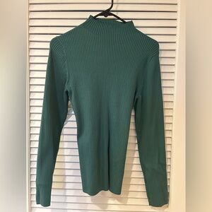 Sculpt knit tie back sweater in green.